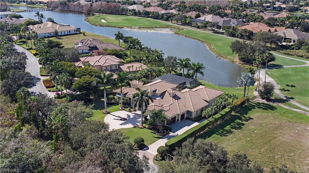 6265 Highcroft Drive Naples, FL 34119 - Photo 21 of 22 an aerial view of a city with lots of residential buildings ocean and mountain view in back