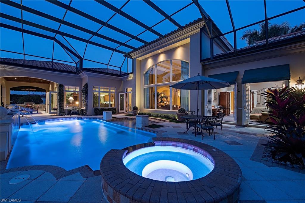 6265 Highcroft Drive Naples, FL 34119 - Photo 4 of 22 a view of a swimming pool with chairs