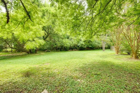 a view of yard with swimming pool