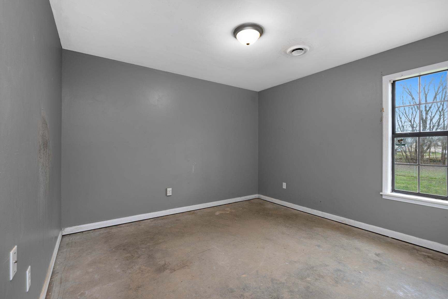 1368 Mathis Road Drummonds, TN 38023 - Photo 22 of 29 an empty room with windows