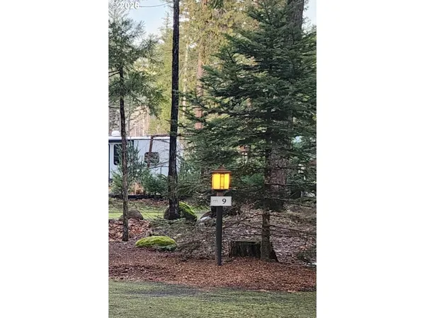 a picture of a bench in the front of a house