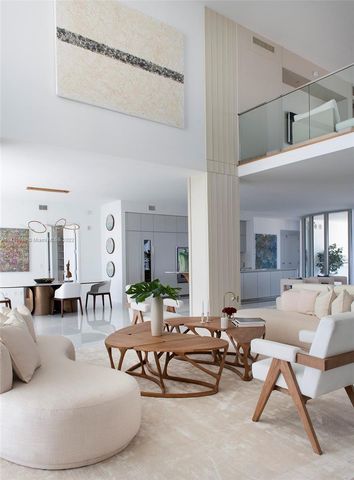 a kitchen with stainless steel appliances kitchen island granite countertop a table and chairs