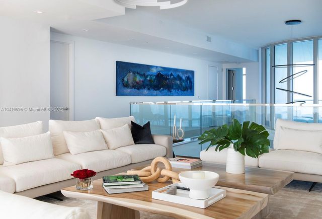 a roof deck with a table and chairs