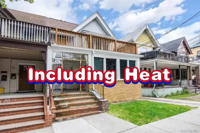 a front view of a building with red and white umbrellas