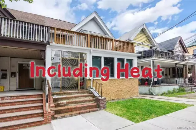 a view of street with an entrance and a house