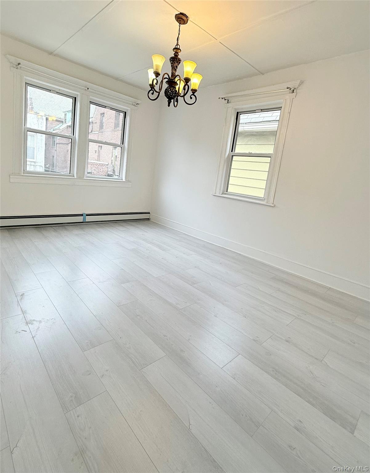 88-08 88th Street Queens, NY 11421 - Photo 23 of 32 a view of an empty room with a window