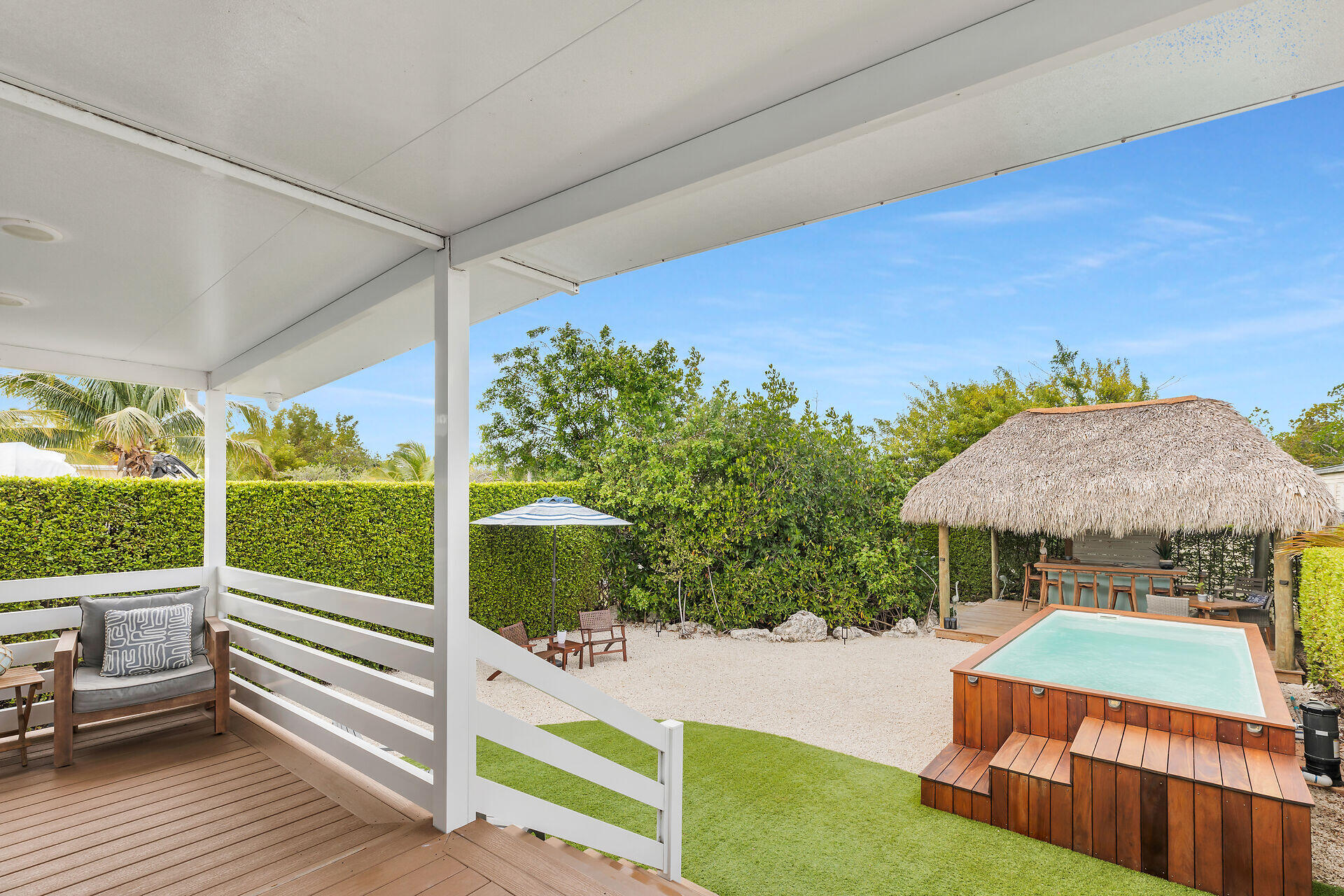 553 Oldsmar Lane Key Largo, FL 33037 - Photo 15 of 48 a view of a patio with chairs next to a yard