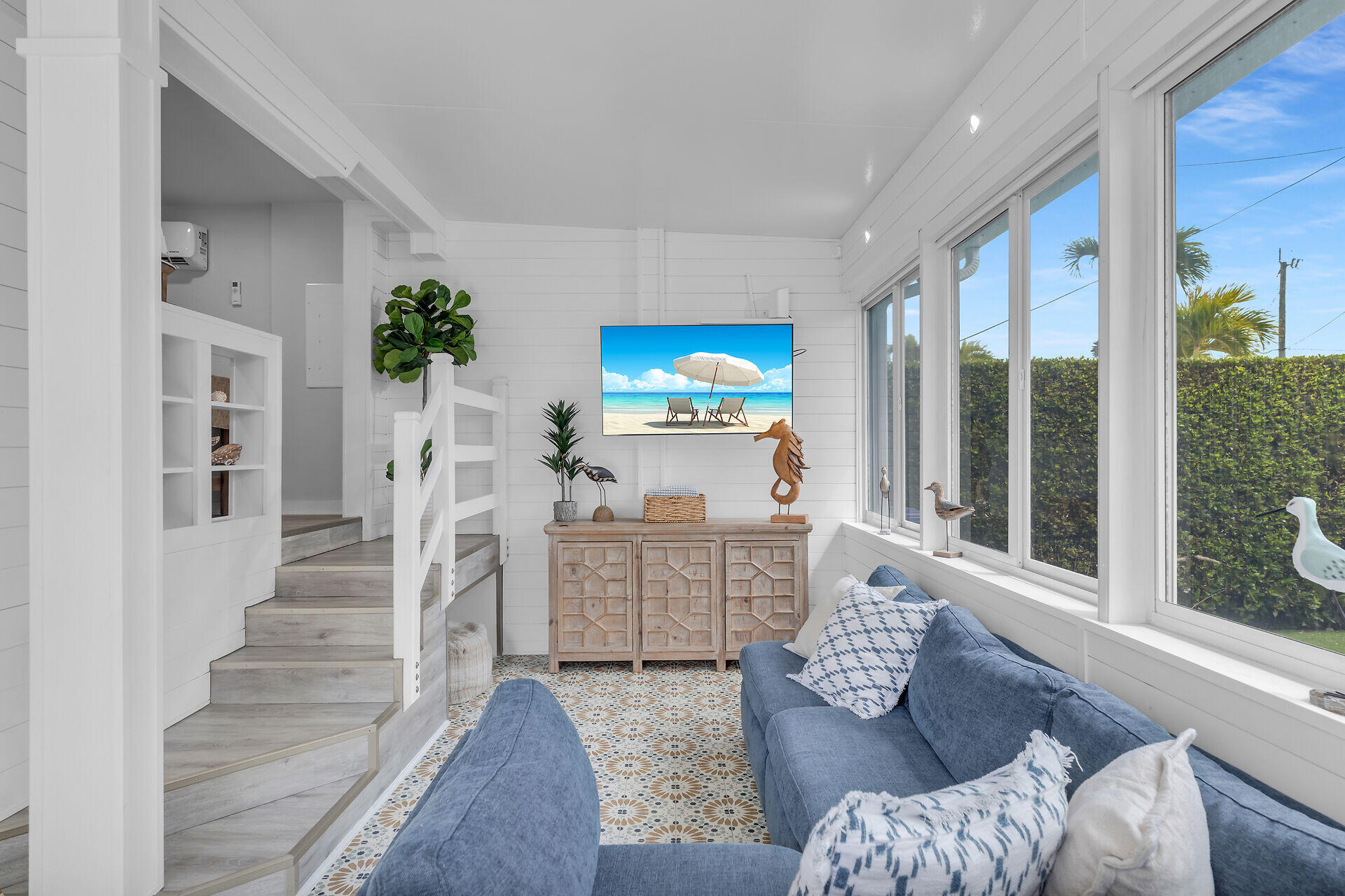553 Oldsmar Lane Key Largo, FL 33037 - Photo 21 of 48 a living room with furniture a flat screen tv and a large window