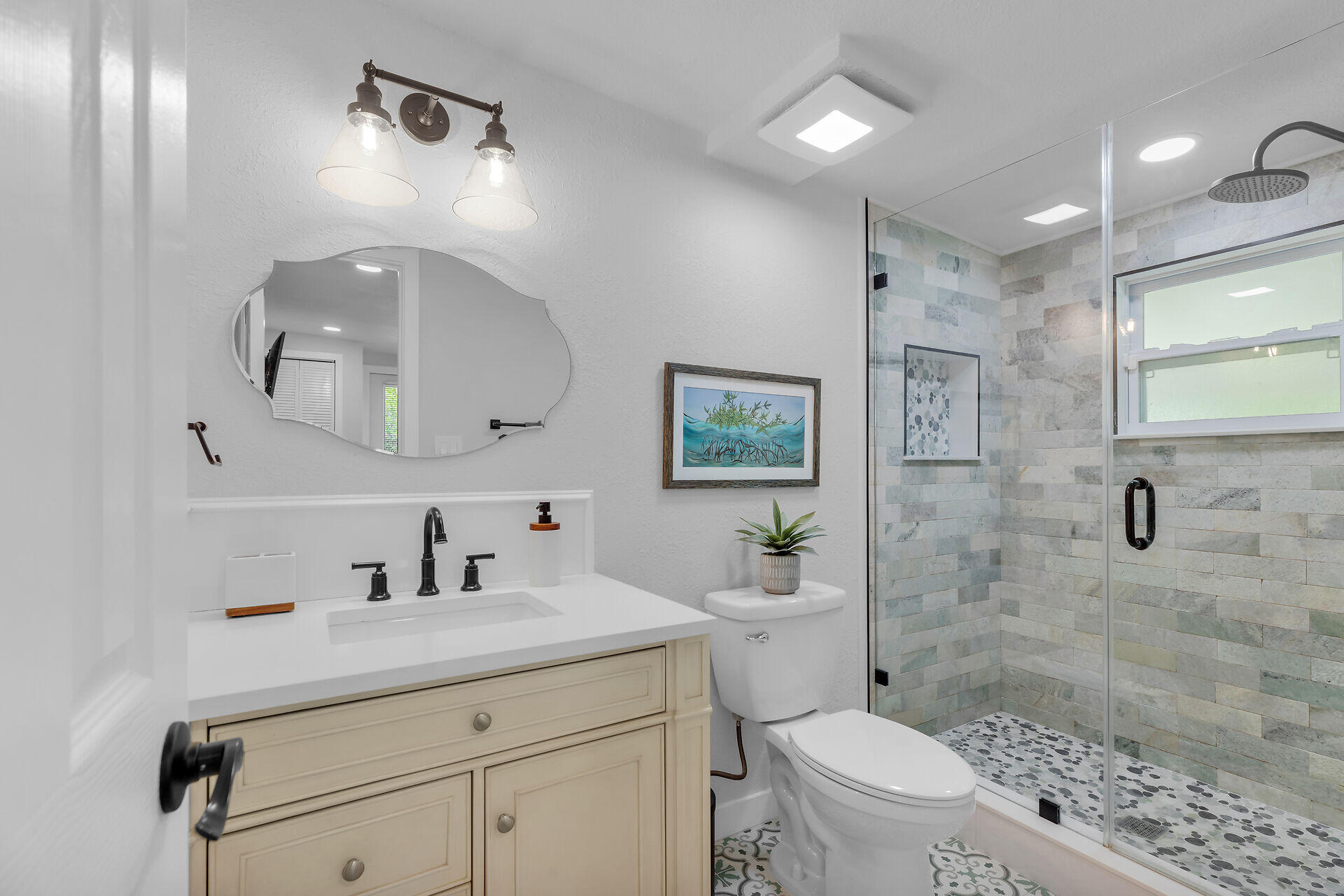 553 Oldsmar Lane Key Largo, FL 33037 - Photo 43 of 48 a bathroom with a sink a toilet a mirror and shower