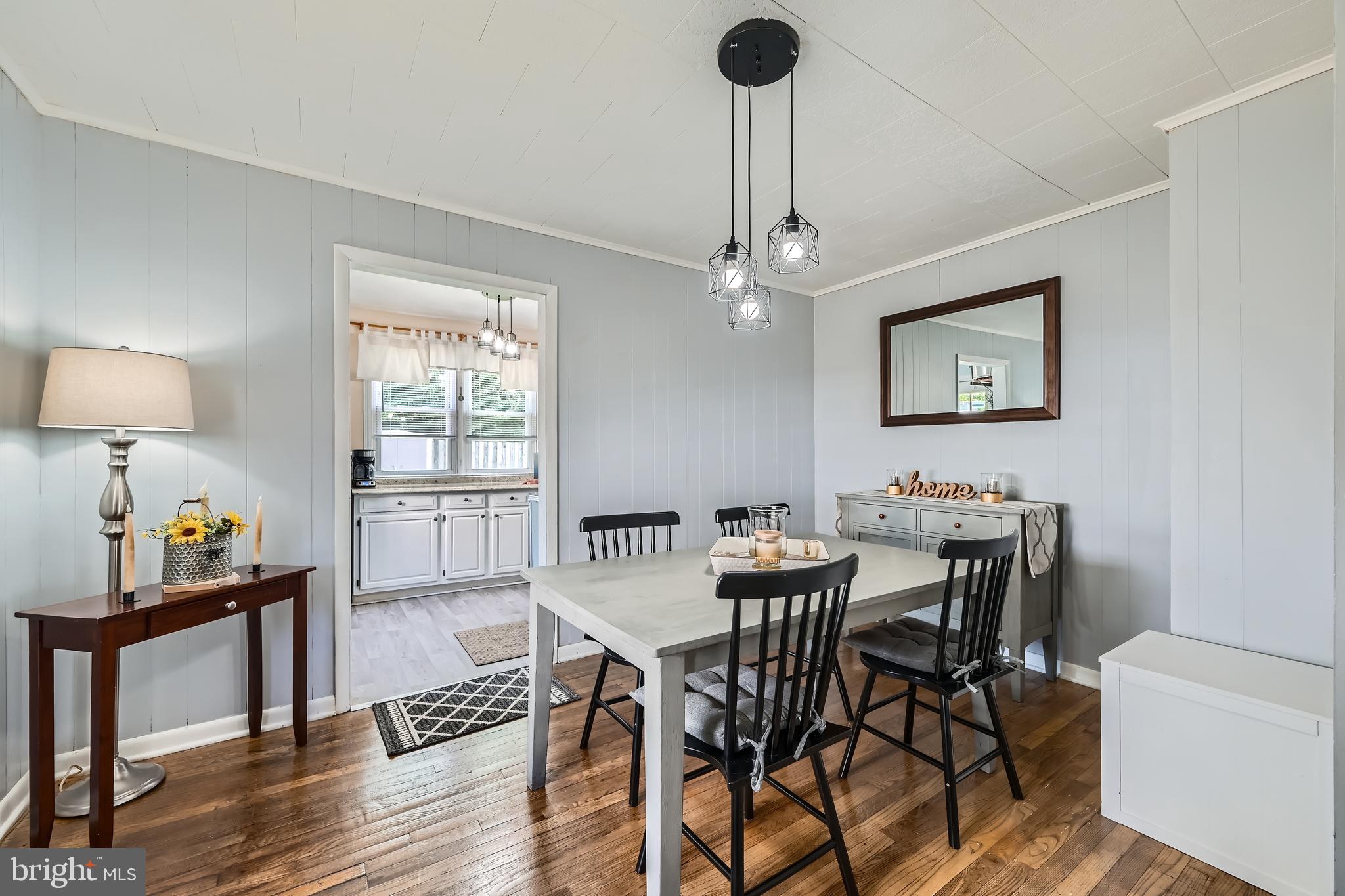 1905 Jackson Road Baltimore, MD 21222 - Photo 8 of 28 a view of a dining room with furniture a chandelier and wooden floor