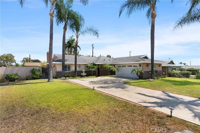 a swimming pool with outdoor seating and yard