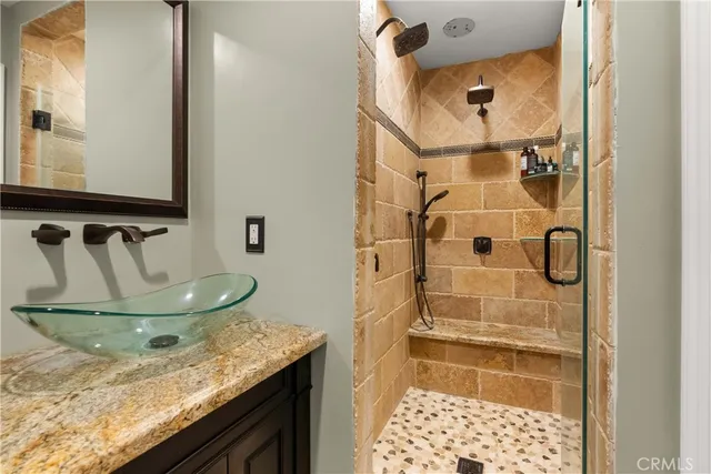 a bathroom with a sink and a mirror