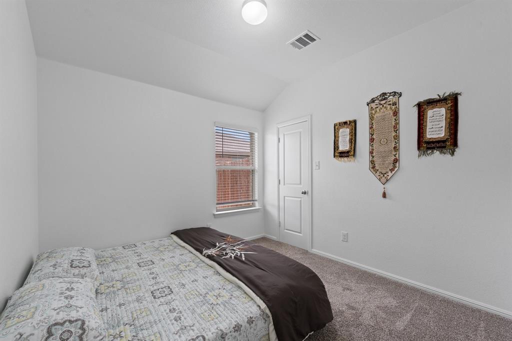 4600 Fringetree Way Crowley, TX 76036 - Photo 27 of 40 Bedroom featuring neutral wall paint, gray carpeting, a window with horizontal blinds, and a white interior door