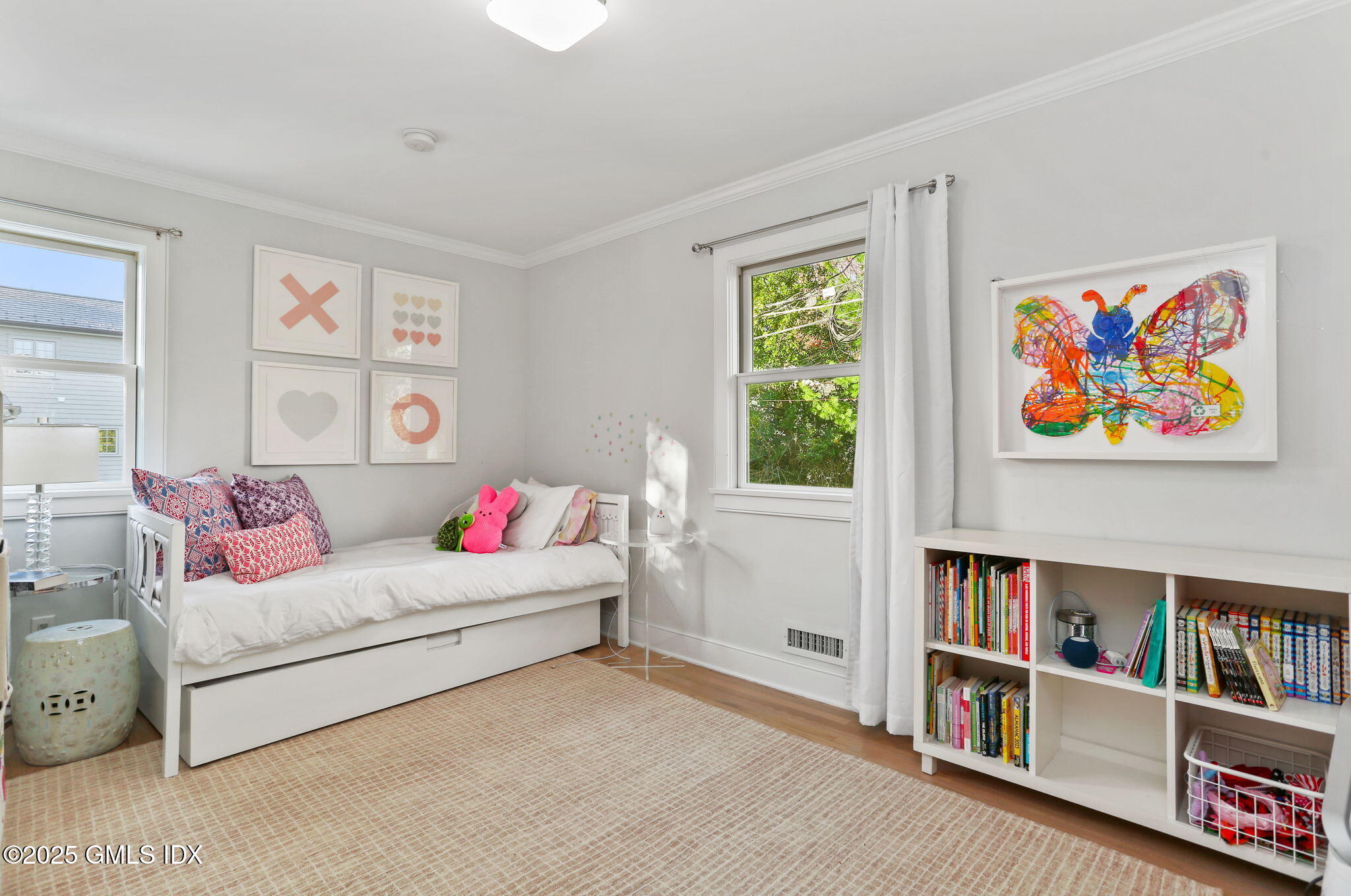 6 Meadowbank Road Old Greenwich, CT 06870 - Photo 16 of 30 a living room with furniture and a book shelf