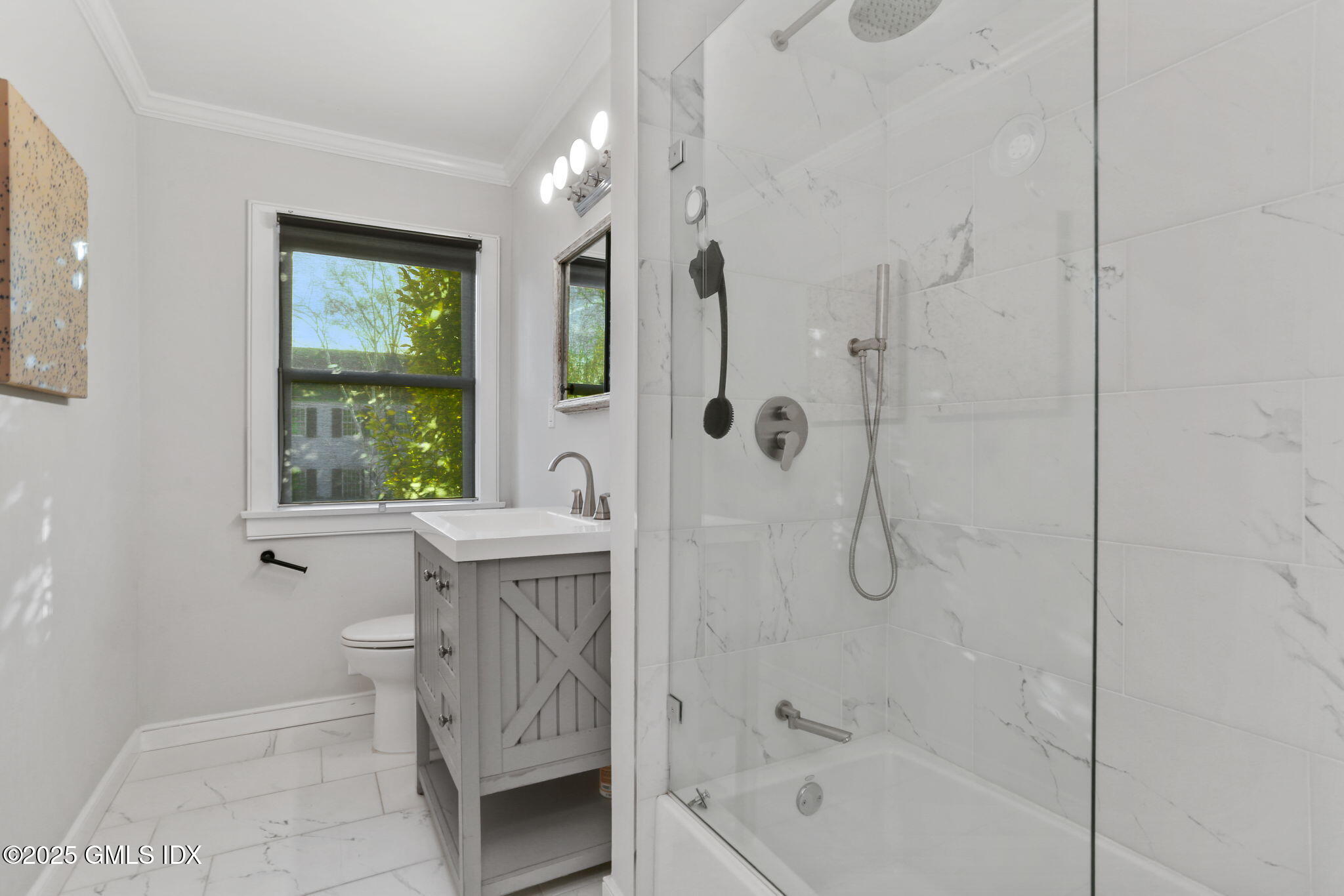 6 Meadowbank Road Old Greenwich, CT 06870 - Photo 17 of 30 a bathroom with a bathtub shower sink and mirror