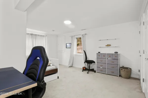 a view of workspace with furniture and a window