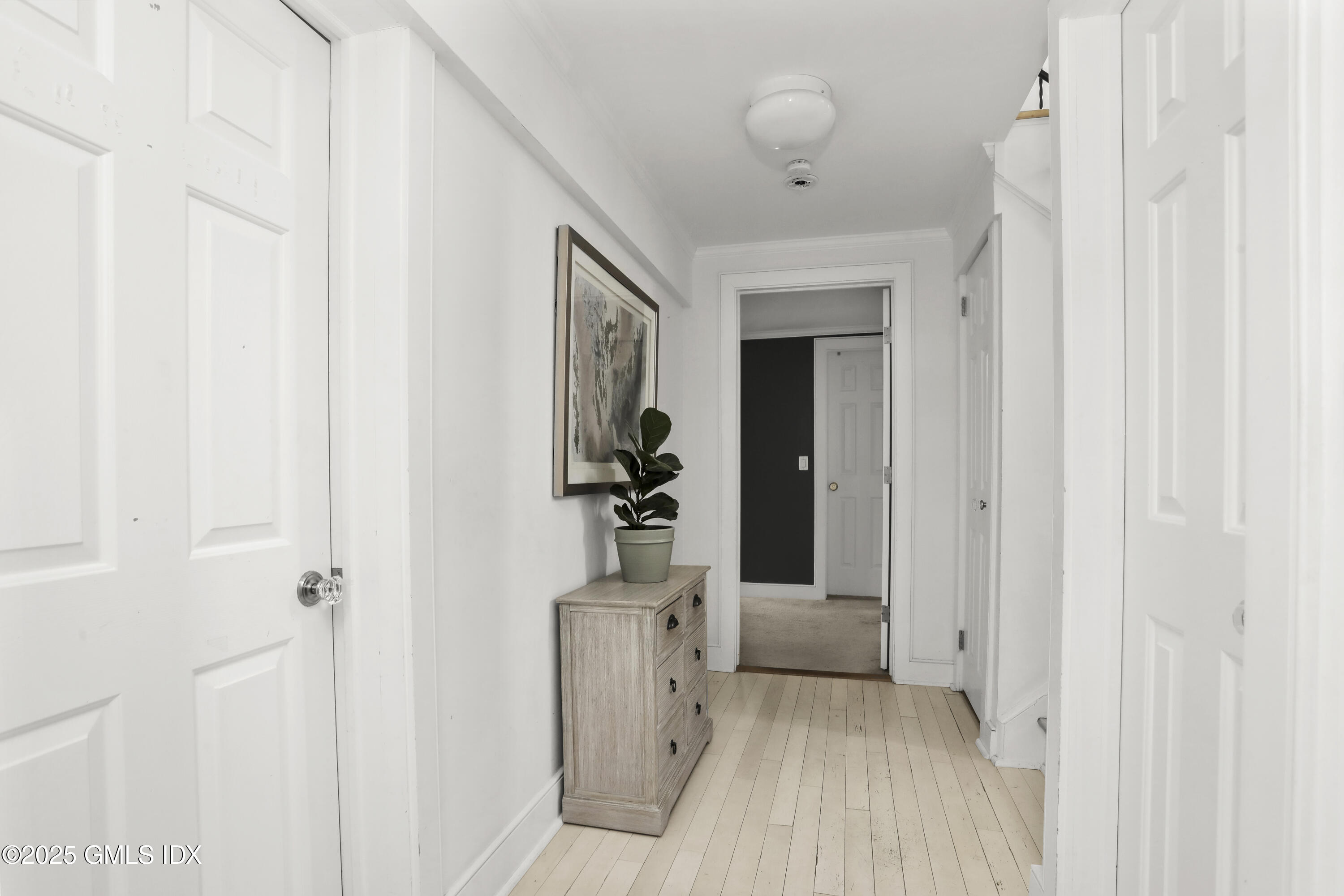 6 Meadowbank Road Old Greenwich, CT 06870 - Photo 20 of 30 a view of a hallway with wooden floor and a bathroom
