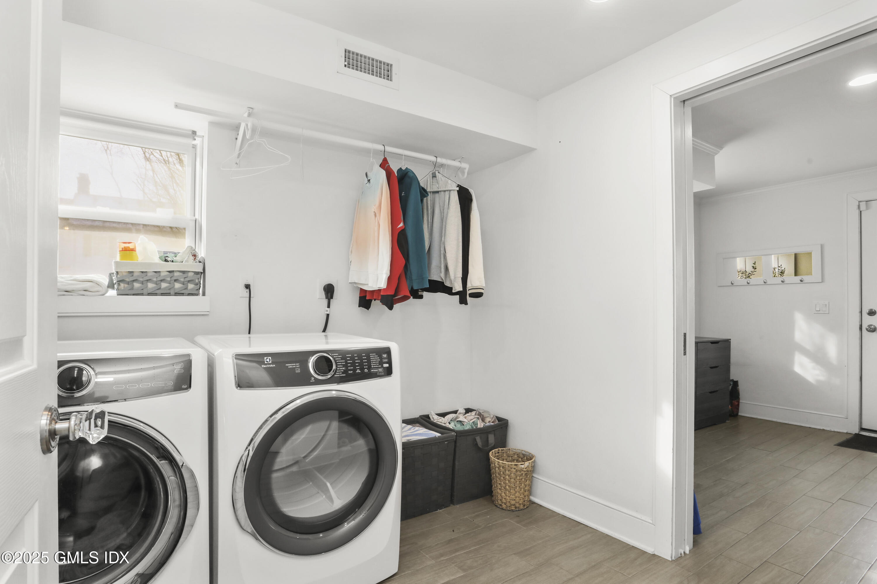 6 Meadowbank Road Old Greenwich, CT 06870 - Photo 21 of 30 a view of a storage & utility room with washer and dryer