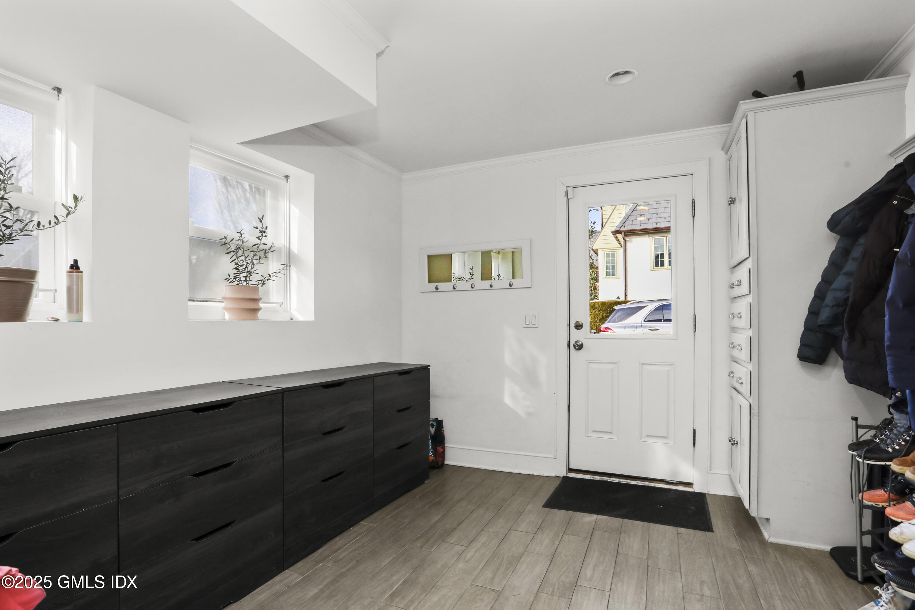 6 Meadowbank Road Old Greenwich, CT 06870 - Photo 22 of 30 a view of walk in closet with clothes and shoes
