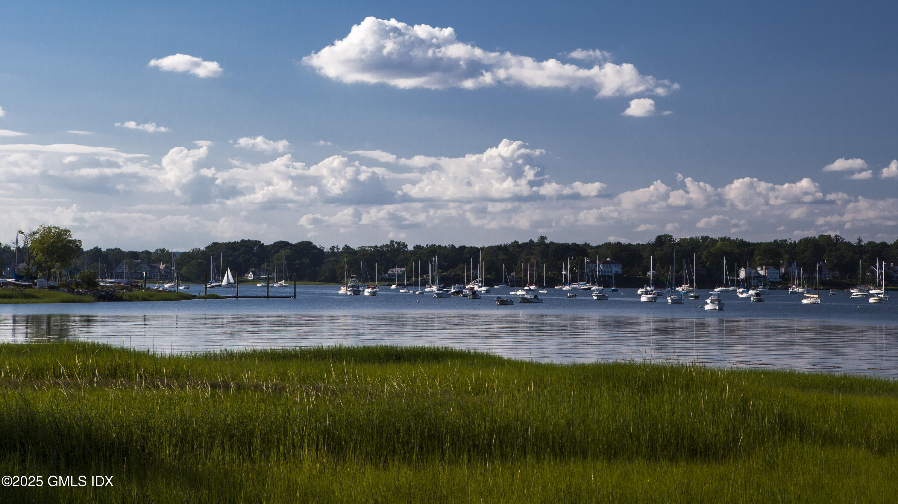 6 Meadowbank Road Old Greenwich, CT 06870 - Photo 27 of 30 a view of a lake with a mountain in the background