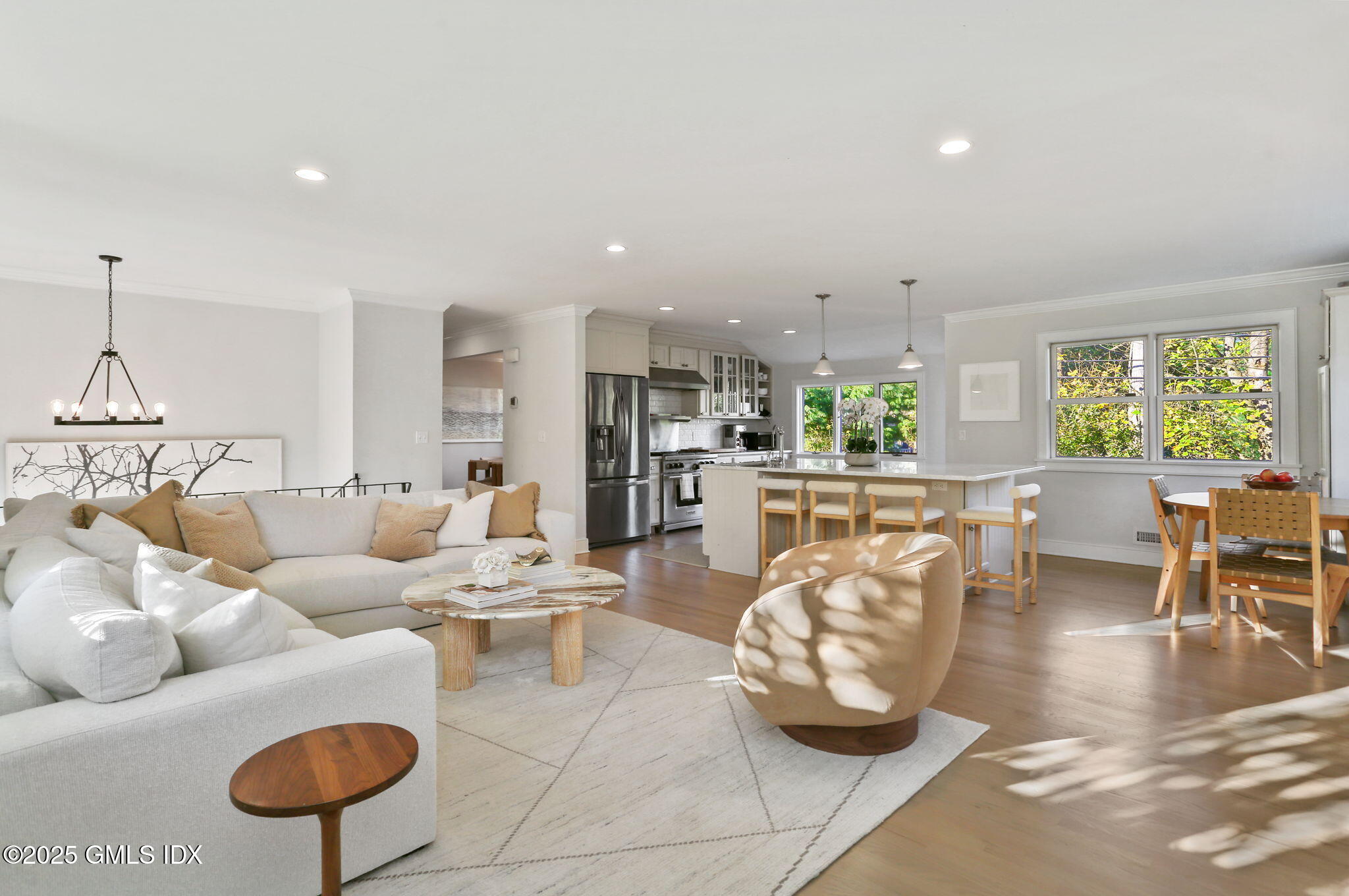 6 Meadowbank Road Old Greenwich, CT 06870 - Photo 10 of 30 a living room with furniture a chandelier and a dining table