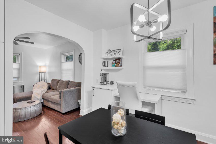 3310 Elbert Street Baltimore, MD 21229 - Photo 14 of 23 a living room with furniture and a chandelier