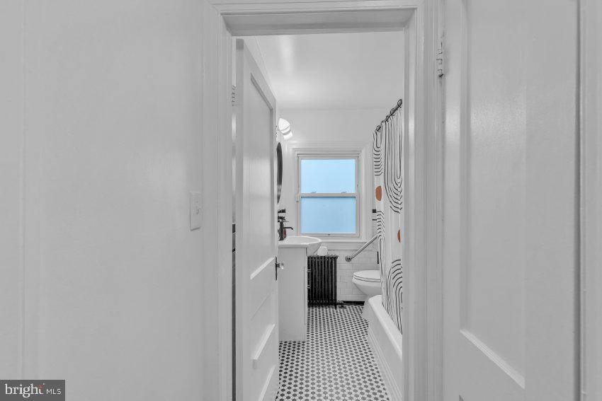 3310 Elbert Street Baltimore, MD 21229 - Photo 15 of 23 a bathroom with a sink and a mirror