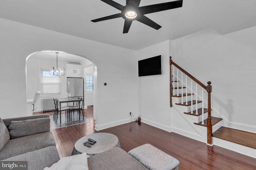 3310 Elbert Street Baltimore, MD 21229 - Photo 6 of 23 a living room with furniture and a wooden floor
