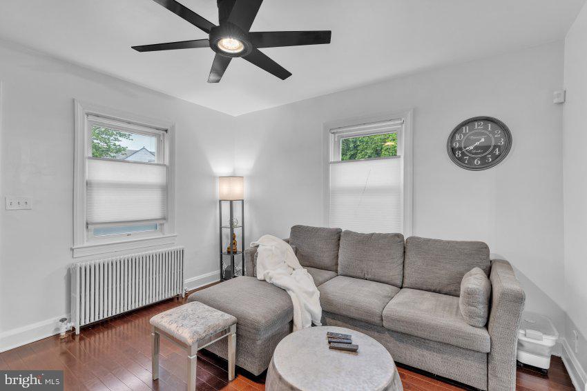 3310 Elbert Street Baltimore, MD 21229 - Photo 8 of 23 a living room with furniture a window and a window