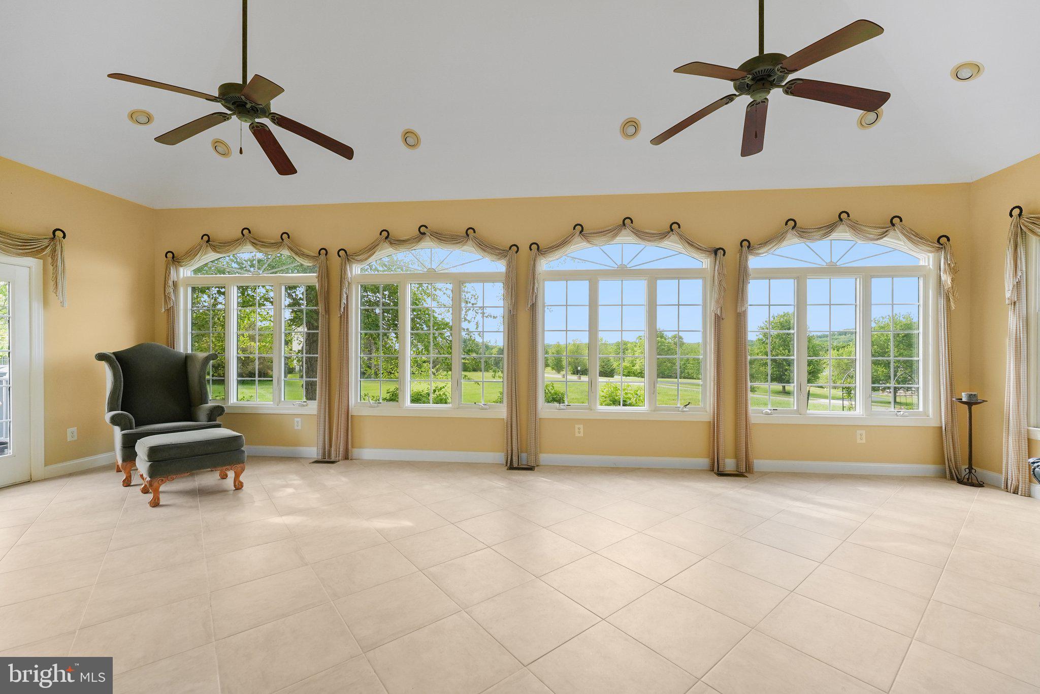 1 Baker Way Pennington, NJ 08534 - Photo 26 of 77 a view of an empty room with a ceiling fan and a window
