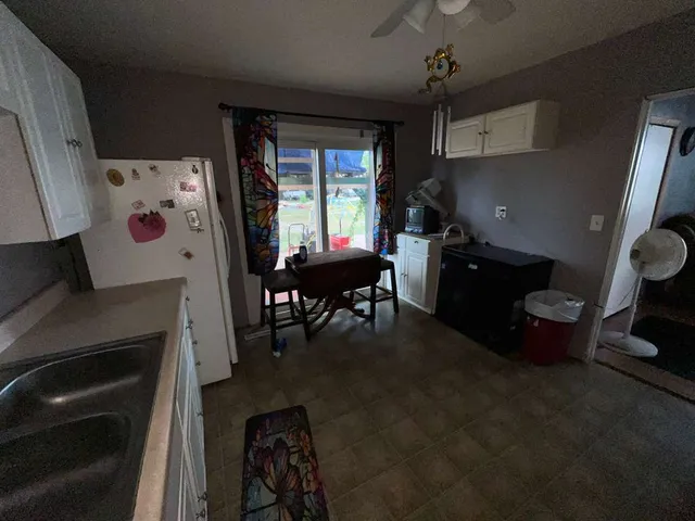 a kitchen with stainless steel appliances granite countertop a stove and a refrigerator
