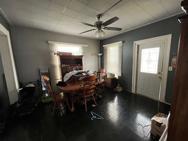 a view of a livingroom with furniture window and wooden floor