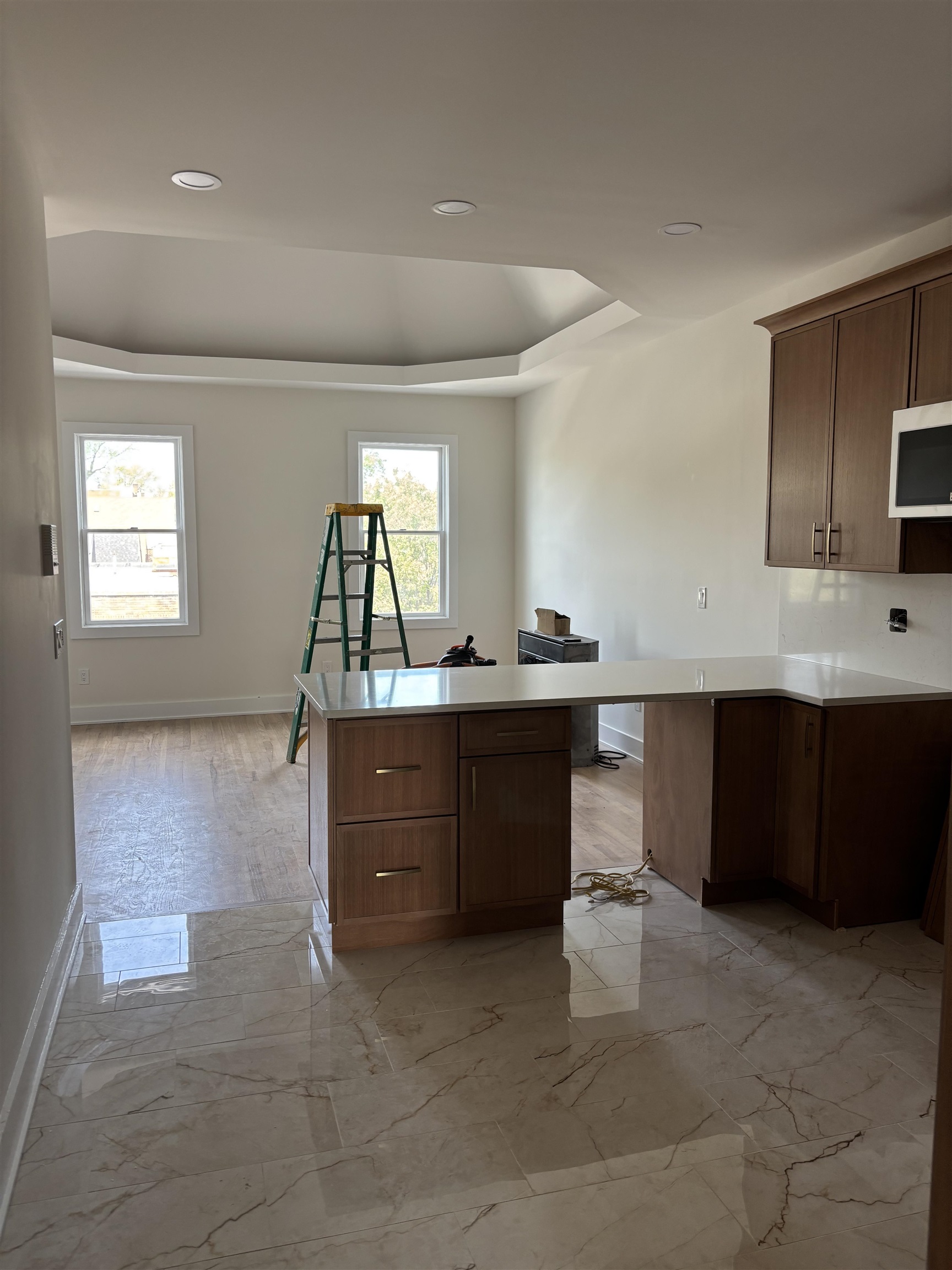 a kitchen with a sink cabinets and window