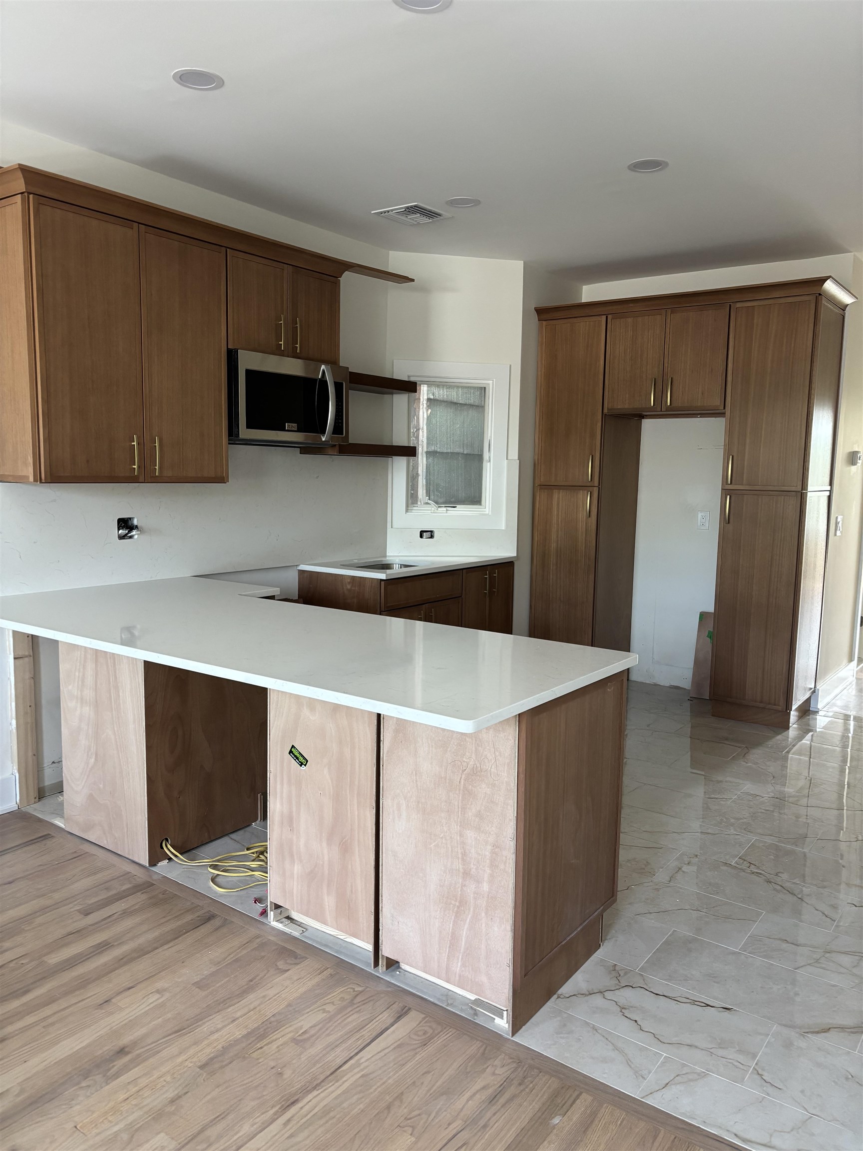 802 Broadway, Unit 3R Bayonne, NJ 07002 - Photo 6 of 8 a kitchen with stainless steel appliances a refrigerator and a stove top oven
