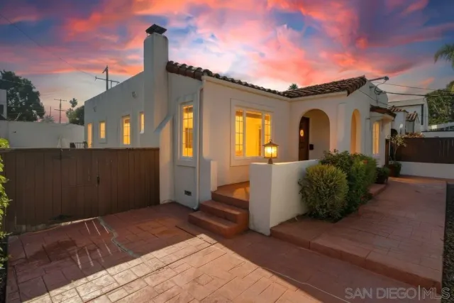 a front view of a house with large windows