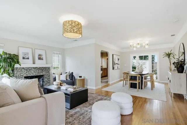 a living room with furniture and a table