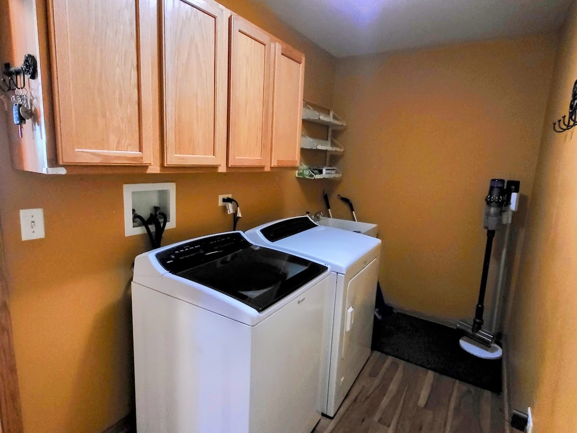 156 Sycamore Drive Bolingbrook, IL 60490 - Photo 14 of 26 a kitchen with a sink a stove and cabinets