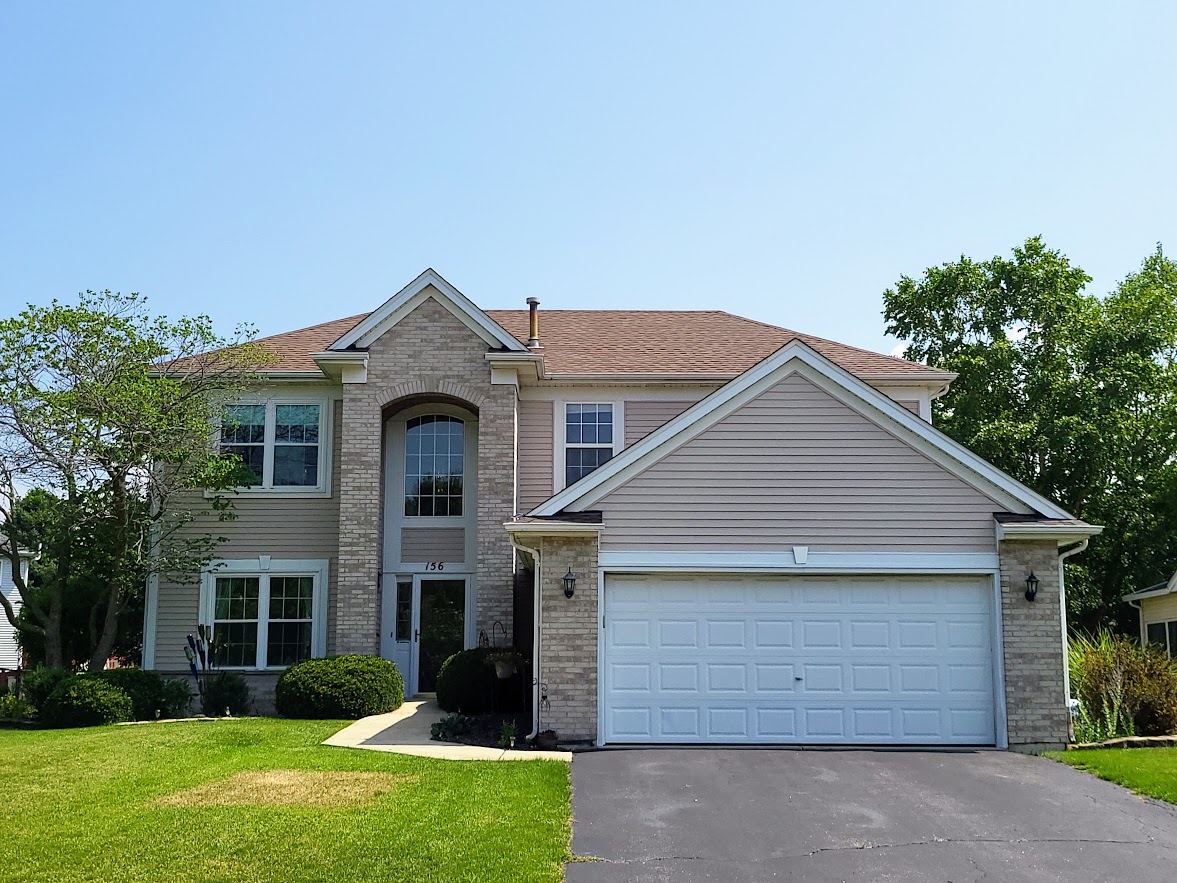 156 Sycamore Drive Bolingbrook, IL 60490 - Photo 2 of 26 front view of a house with a yard