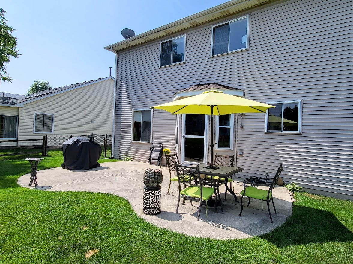 156 Sycamore Drive Bolingbrook, IL 60490 - Photo 26 of 26 a view of a house with backyard sitting area and a garden