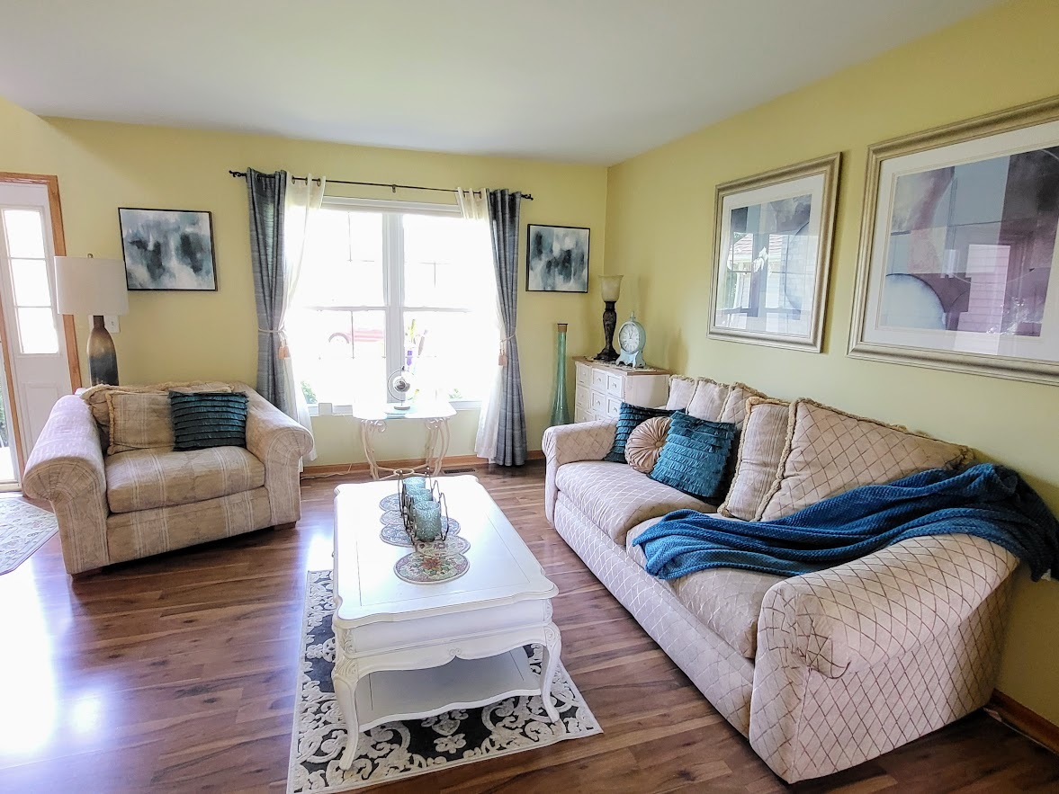156 Sycamore Drive Bolingbrook, IL 60490 - Photo 4 of 26 a living room with furniture and a large window