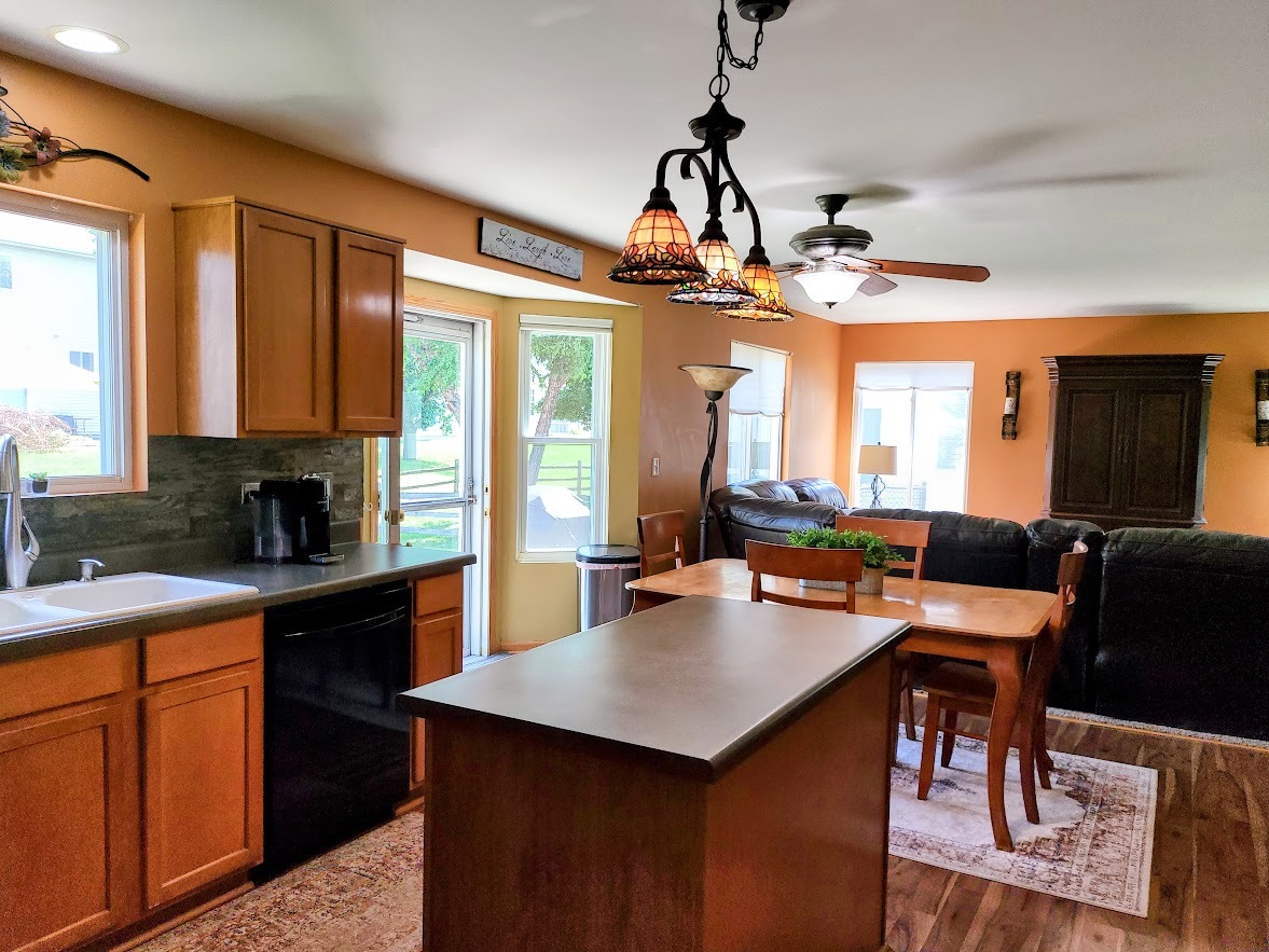 156 Sycamore Drive Bolingbrook, IL 60490 - Photo 9 of 26 a view of a dining room with furniture window and wooden floor