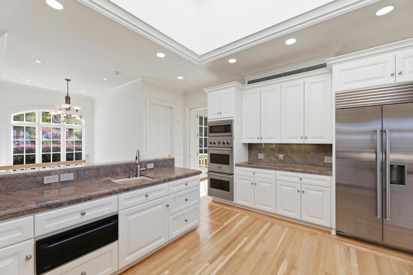 14113 Pike Road Saratoga, CA 95070 - Photo 22 of 78 a kitchen with stainless steel appliances granite countertop a sink and cabinets