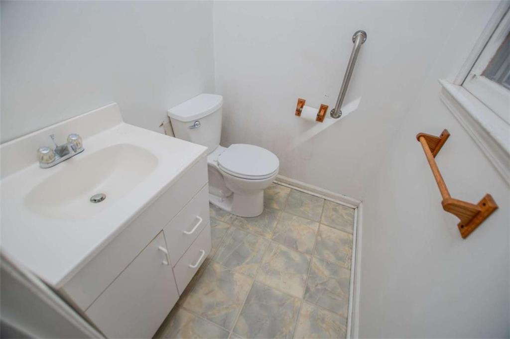 7104 Miller Street Lithia Springs, GA 30122 - Photo 12 of 18 a bathroom with a sink and a toilet