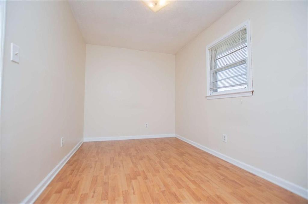 7104 Miller Street Lithia Springs, GA 30122 - Photo 8 of 18 a view of a room that has wooden floor and view of a small space