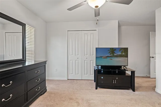 wooden floor with a black and white cabinet