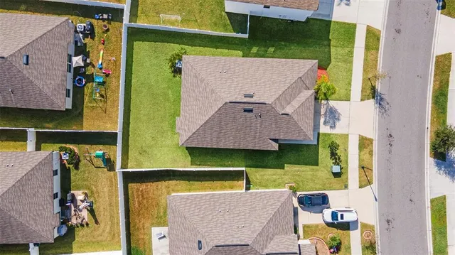 a view of a house with garden and yard