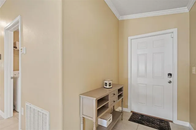 a room that has a window and a table in it