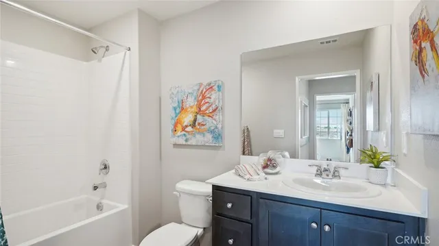 a bathroom with a sink a toilet and a bathtub