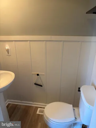 a bathroom with a toilet and a sink