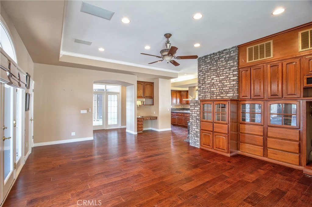 46856 El Prado Road Temecula, CA 92590 - Photo 27 of 75 an empty room with wooden floor and windows